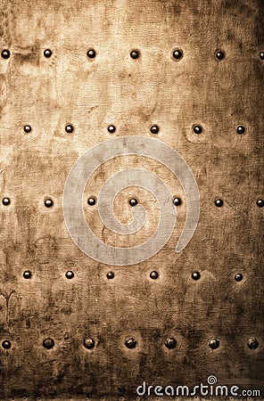 Grunge gold brown metal plate rivets screws background texture Stock Photo