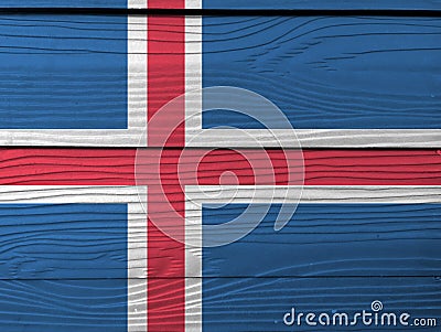 Grunge Iceland flag texture, blue sky with a snow-white cross, and a fiery-red cross inside the white. Stock Photo