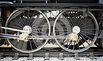 Grunge old steam locomotive wheel and rods Stock Photo