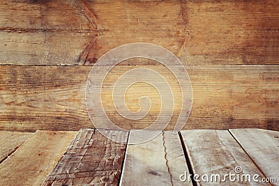 Grunge vintage wooden board table in front of old wooden background. Ready for product display montages Stock Photo