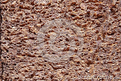 Grungy sandstone surface. Weathered rough texture of natural stone. Porous stone closeup. Ancient rustic surface photo Stock Photo