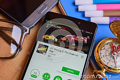 GT Racing 2: The Real Car Exp dev app on Smartphone screen. Editorial Stock Photo