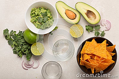 Guacamole, corn chips and beer, light Mexican snack or dinner, , top view Stock Photo