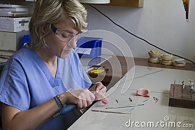 Guadalupe, Ecuador - May 27, 2014: Dental technician works on dentures Editorial Stock Photo