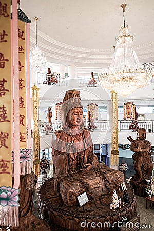 Guan Yin statue made from wood in Hyuaplakang temple Editorial Stock Photo