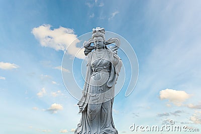 Guan Yin statue stone god of china on sky background. Stock Photo