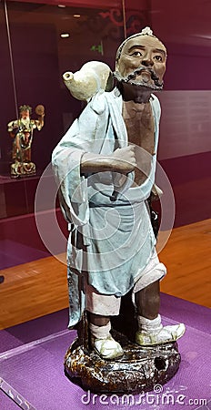 Guangdong China Porcelain Foshan Shiwan Ceramic Figurine Portrait Chinese Taoist Immortal Iron-Crutch Li Sculpture Art Crafts Editorial Stock Photo