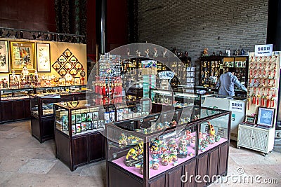 Guangdong, a famous tourist attraction in China, sells shops of folk arts and crafts in Chen Clan Academy Editorial Stock Photo
