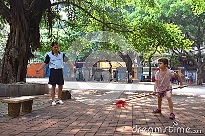 GUANGZHOU, CHINA - CIRCA MAY 2020: A little white girl practises kung-fu with a Chinese martial arts teacher Editorial Stock Photo