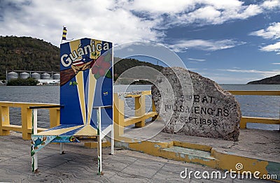 Chair and rock to commemorate American military landing in PR Editorial Stock Photo