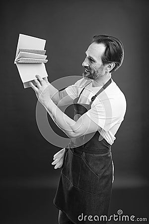 On guard of cleanliness and order. Cleaning service and household duty. Man in apron with gloves hold different sponges Stock Photo