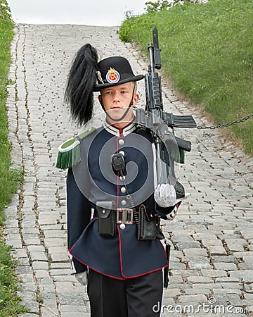 Guard at his post, dressed in a ceremonial uniform, with weapons, very serious and focused on his duty Editorial Stock Photo