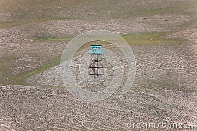 Guard tower with fake border guards in the Tien Shan Stock Photo