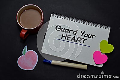 Guard Your Heart write on a book on office desk. Christian faith concept Stock Photo