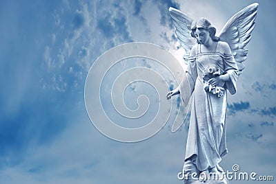 Guardian Angel sculpture over bright sky Stock Photo