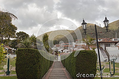 Guatavita colombian town summer scene with pine peatonal street, gardens and mountains Stock Photo