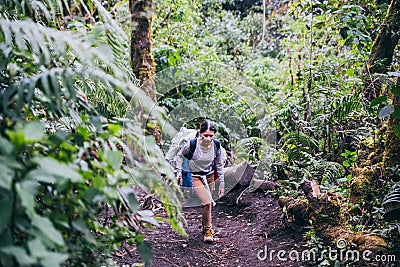 GUATEMALA - January 08: Woman hikes at the forest to get to the top of the Acatenango Volcano, January 08, 2017 near Antigua, Editorial Stock Photo