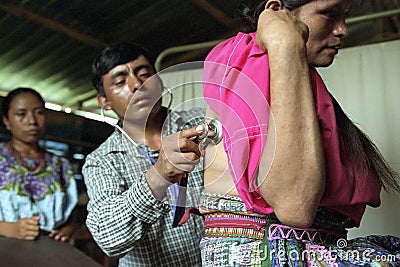 Guatemalan doctor is examines Indian woman Editorial Stock Photo