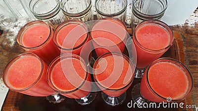 Guava juice in eight glasses on a tray Stock Photo