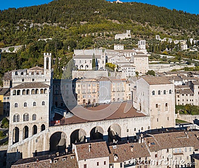 Gubbio, Italy. Drone aerial view of the city center, main square and the historical building called Palazzo dei Consoli Editorial Stock Photo