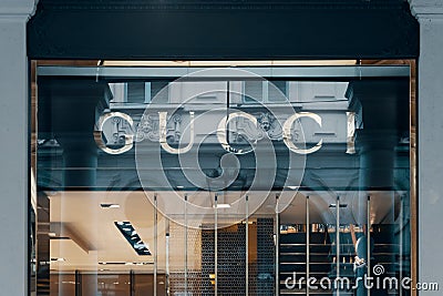 Gucci logo of luxury fashion store showcase. Bergamo, Italy - 29.12.2019 Editorial Stock Photo