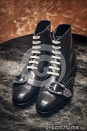 Gucci men brogue black leather boots with very fashionable buckle Stock Photo