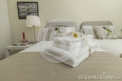 Stylish bedroom and linens in neutral tones Stock Photo