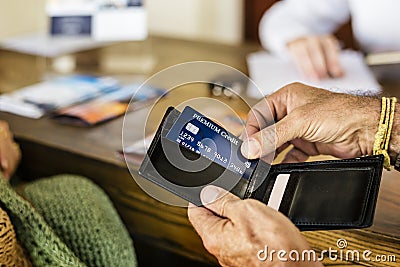 Guests checking in to a hotel reservation counter Stock Photo
