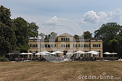 Guests on the terrace in front of the restaurant in the historic Editorial Stock Photo