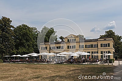 Guests on the terrace in front of the restaurant in the historic Editorial Stock Photo