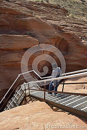 Guide walking down the entrance stairs at Lower Antelope Canyon, Hasdestwazi, LeChee Chapter, Navajo Nation, Arizona Editorial Stock Photo