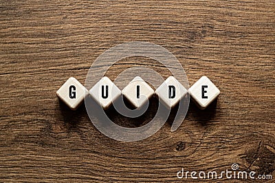 Guide - word concept on building blocks, text Stock Photo