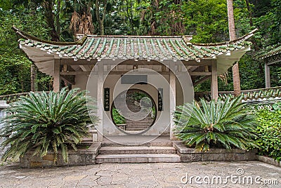 Pavilion with circular doorway to stairway in Seven Star Park, Guilin, China Stock Photo