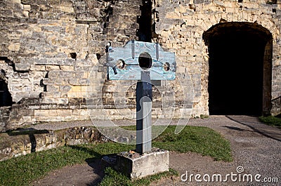 Guillotine over old castle wall Stock Photo