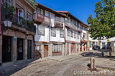 Guimaraes, Portugal - Medieval buildings in the Santiago Square, also known as Sao Tiago Editorial Stock Photo