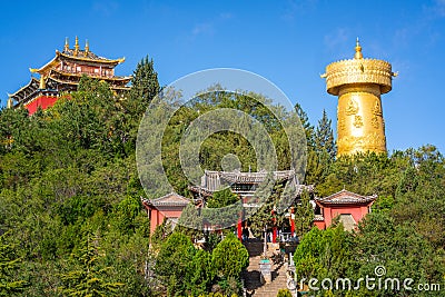 Guishan Dafo temple scenic view with the giant Tibetan Buddhist prayer wheel in Dukezong old town in Shangri-La Yunnan China Editorial Stock Photo
