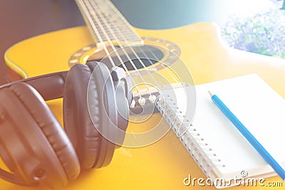 Guitar Headphone notebook for songwriting Stock Photo