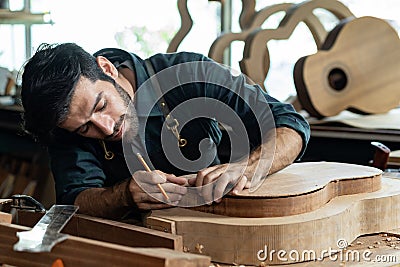 Guitar Luthier Ensures Back and Body Match in Mold Stock Photo