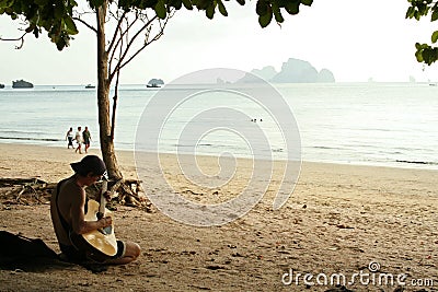 guitar man krabi beach thailand Stock Photo