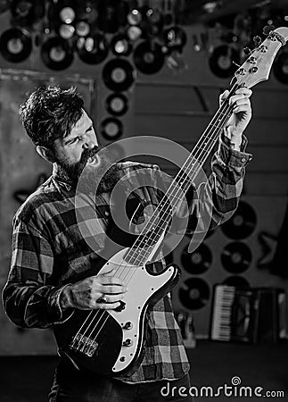 Guitar player concept. Musician with beard play electric guitar Stock Photo