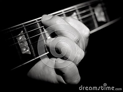 Guitar player fretboard playing chords black Stock Photo