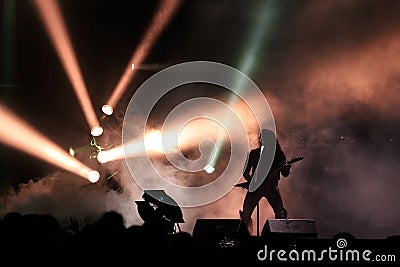 Guitar player silhouette on the stage Editorial Stock Photo