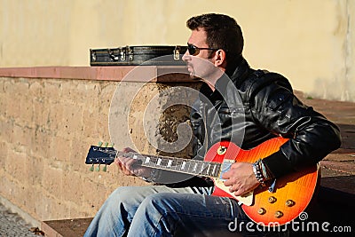 Guitar player at sunset Stock Photo