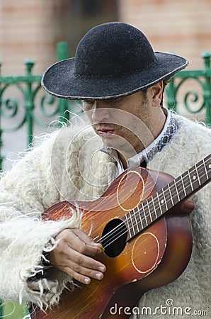 Guitar player in traditional Romanian costume Editorial Stock Photo