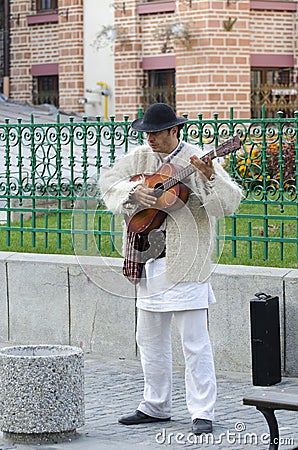 Guitar player in traditional Romanian costume Editorial Stock Photo