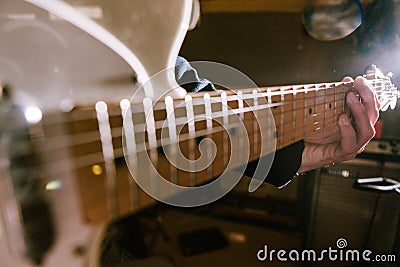 Guitar riff in guitarist hands in selective focus Stock Photo