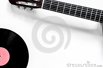 Guitar with vinyl record in music studio for dj or musician work white desk background top view mock-up Stock Photo