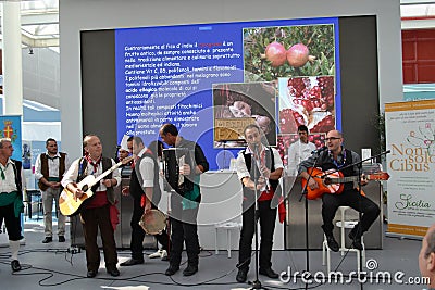 Guitarist, flute, accordion and tambourine players from Sicily at the EXPO Milano 2015. Editorial Stock Photo