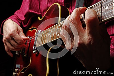 Guitarist hands and guitar close up. playing electric guitar. play the guitar. Stock Photo