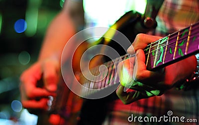 Guitarist hands playing guitar Stock Photo